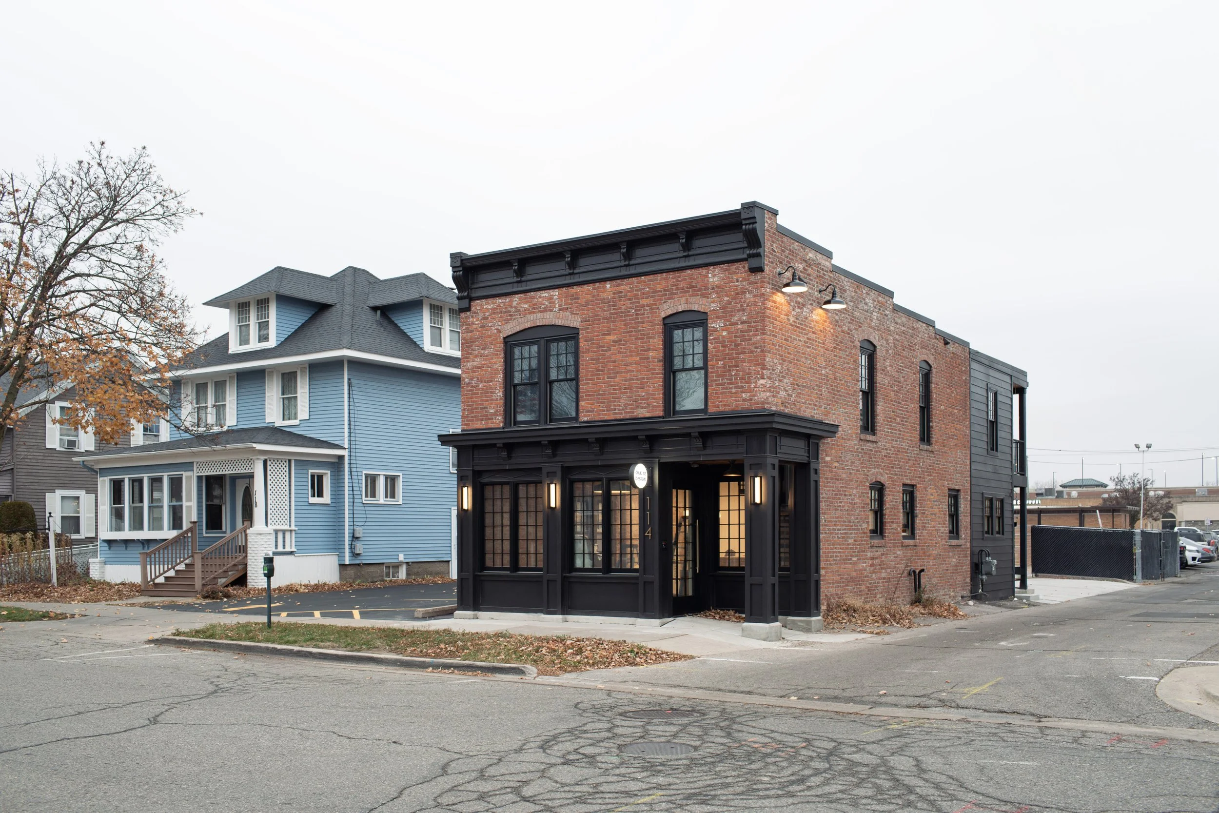 A historic brick building renovated to become the studio for a residential architecture firm, with a blend between traditional and modern elements.