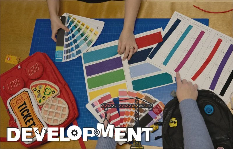 Development text with design items; color wheels, lego bag mock up, etc.