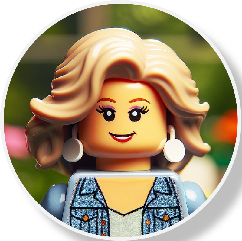 A LEGO minifigure with blonde wavy hair, wearing a denim jacket and white earrings, smiling with a background of blurred greenery.