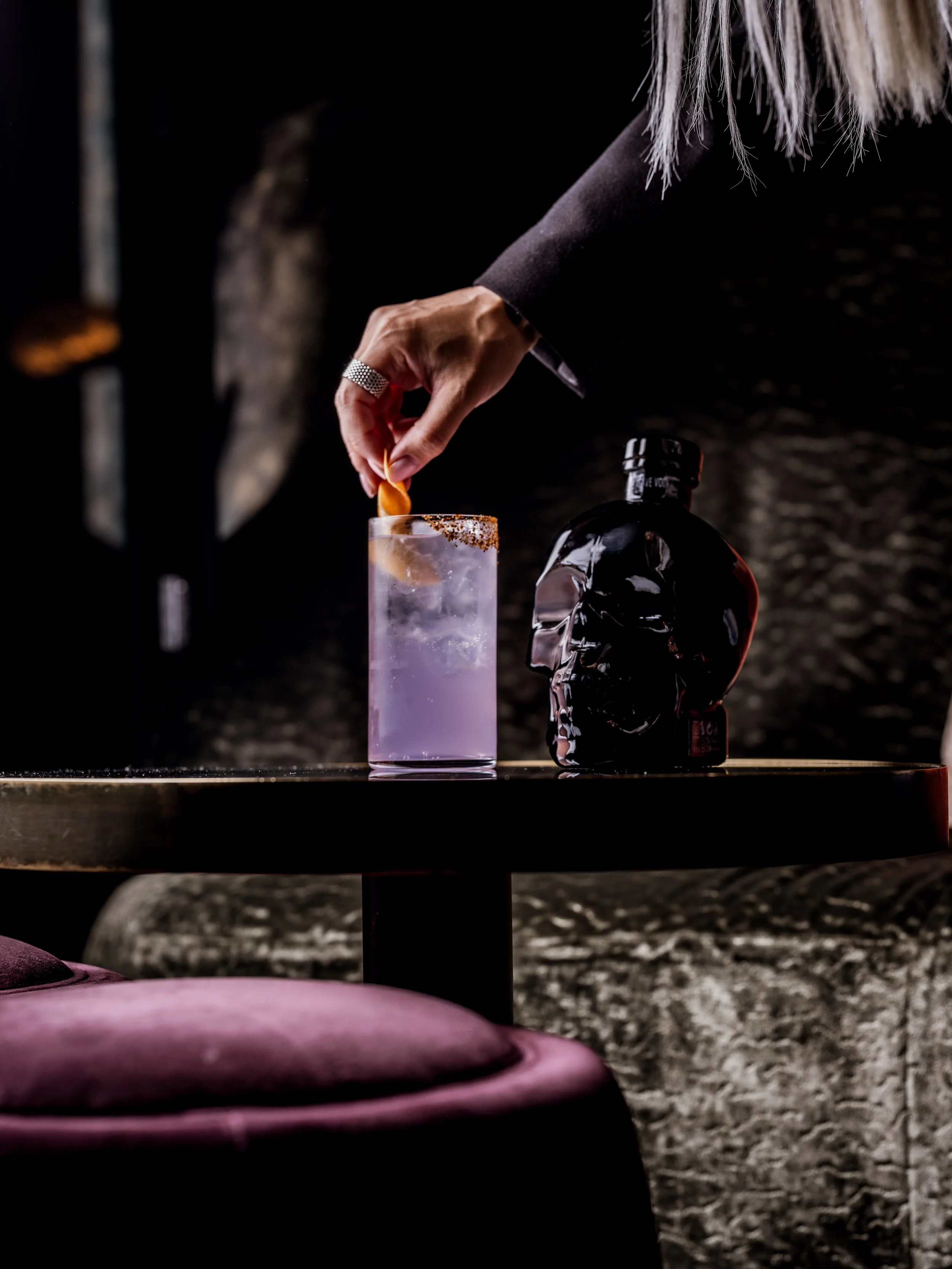 Crystal Head vodka with a garnished purple cocktail
