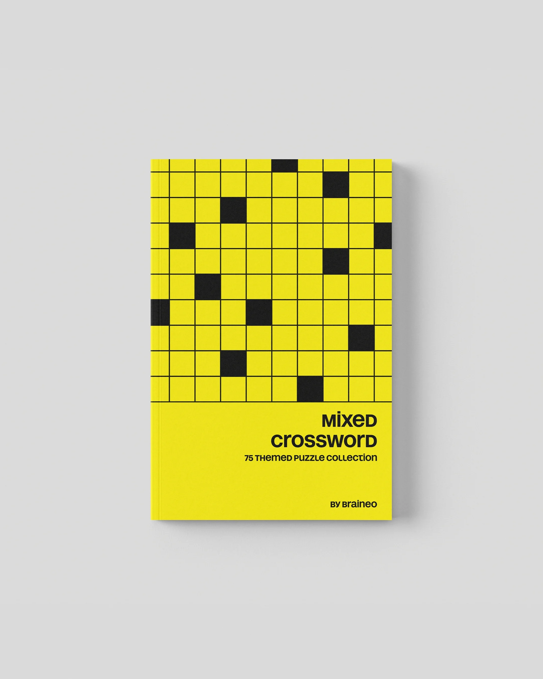 Cover of Braineo Crossword book with 75 mixed topic puzzles and solutions included