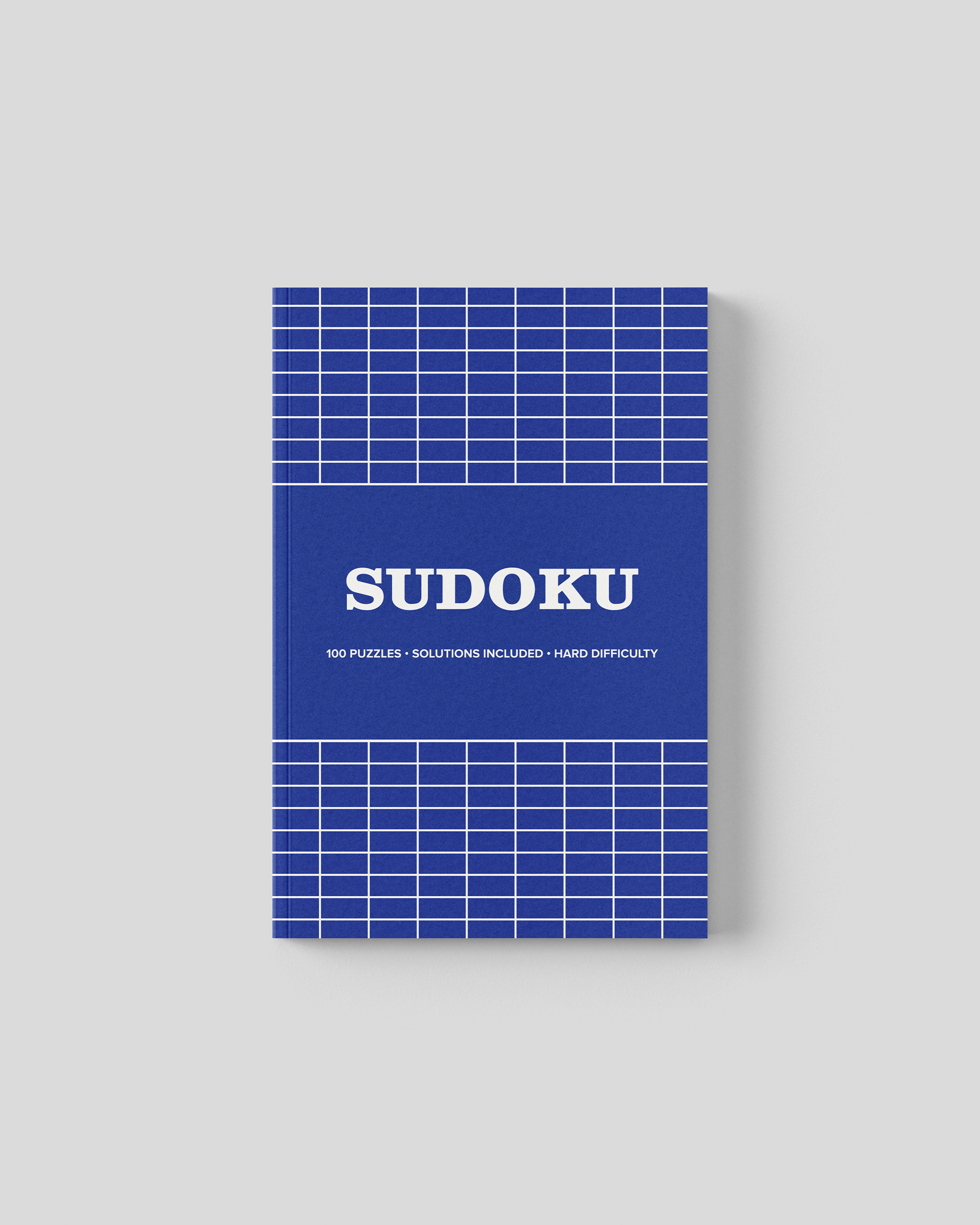 Hard sudoku travel sized puzzle book cover, bold blue grid design, 5 x 8 inches with 100 puzzles and solutions included.