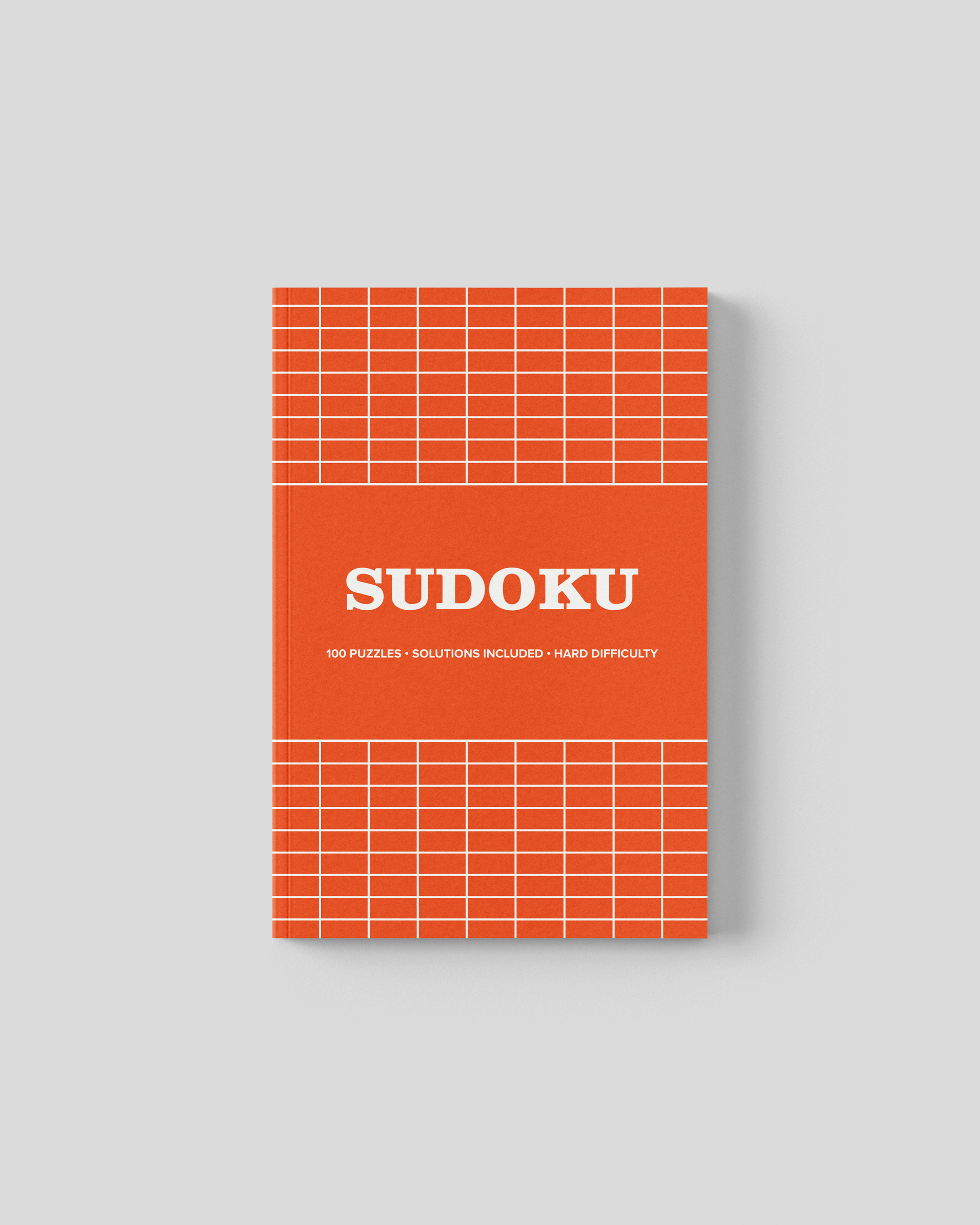 Hard 12x12 grid sudoku travel sized puzzle book cover, bright orange grid design, 5 x 8 inches with 100 puzzles and solutions included.