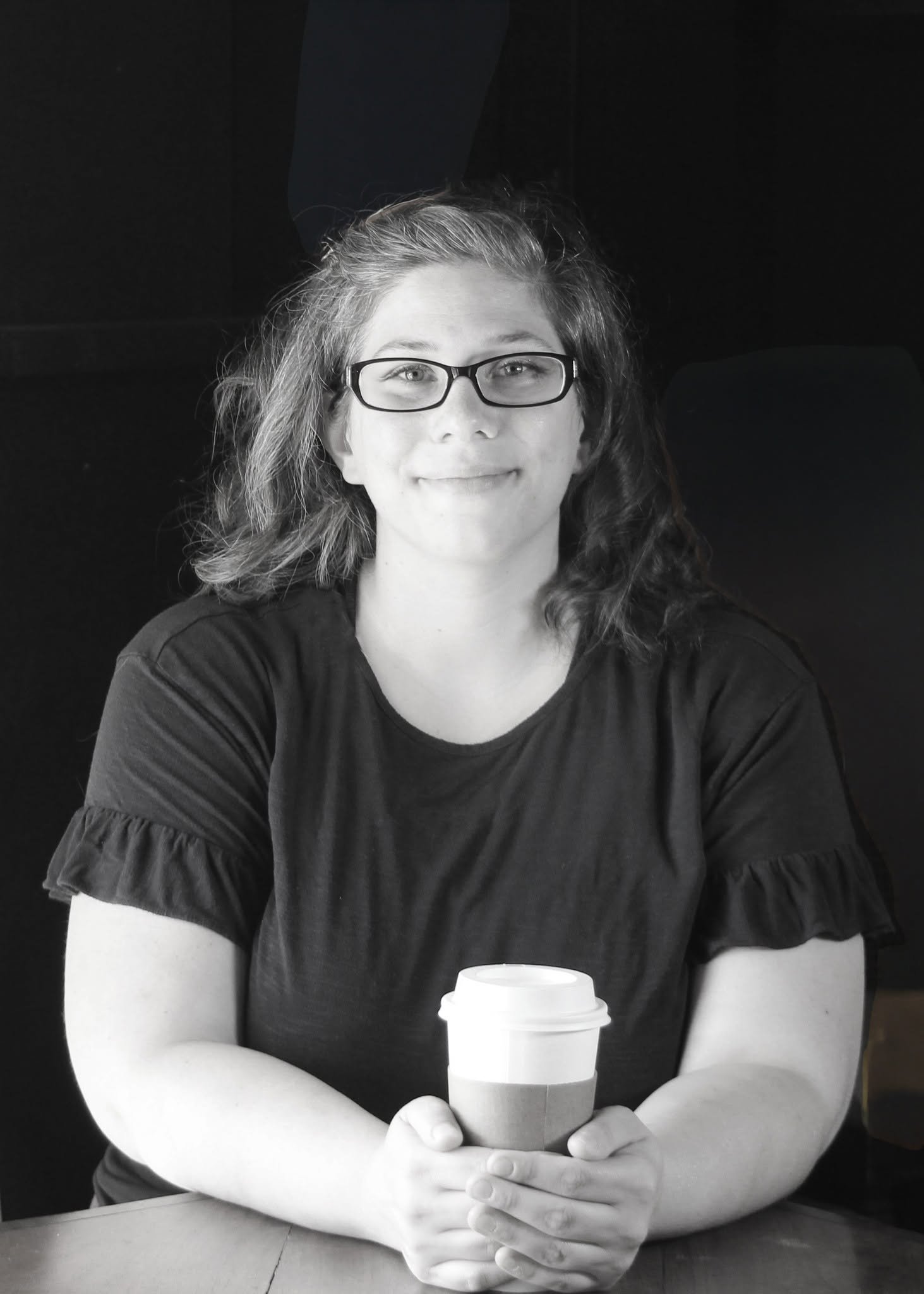 Woman looking at camera with coffee in her hand. | Website Design in Mountain View Missouri