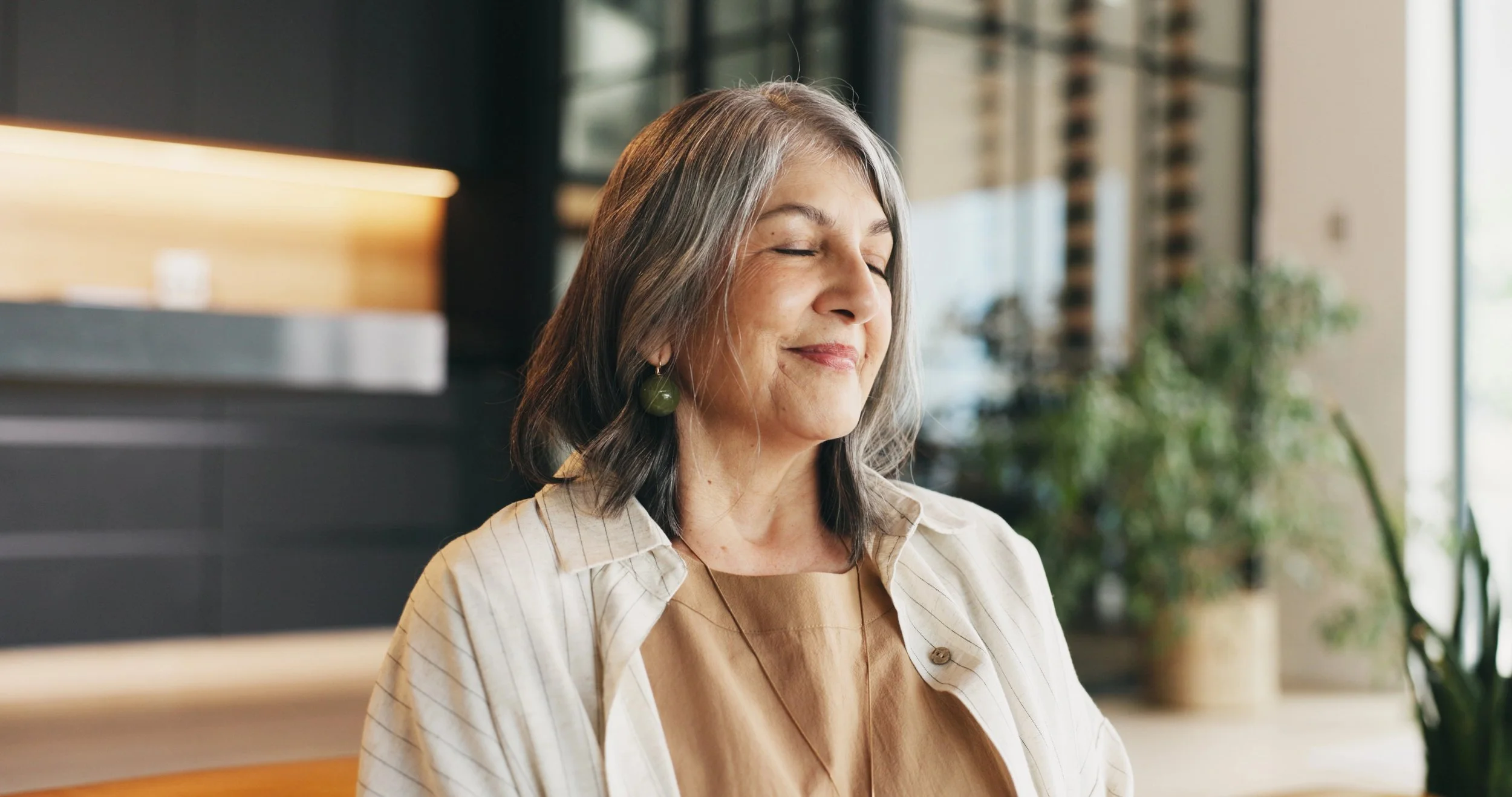 older therapist eyes closed in meditation.jpg