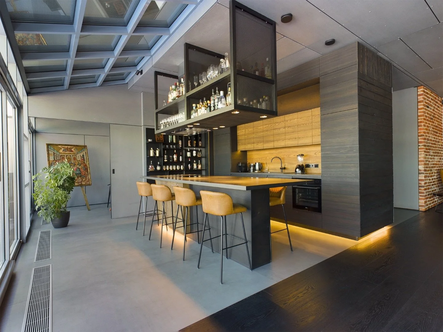 Moderne Design-Küche mit Bar als Referenz für hochwertige Immobilienvermarktung durch BY Birnstiel im Aargau und Zürich.