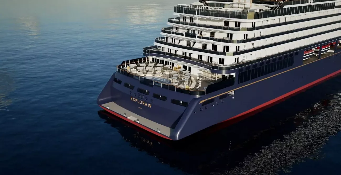 A large cruise ship named Explora IV on calm ocean waters, showing multiple decks with balconies and an outdoor lounge area at the front.