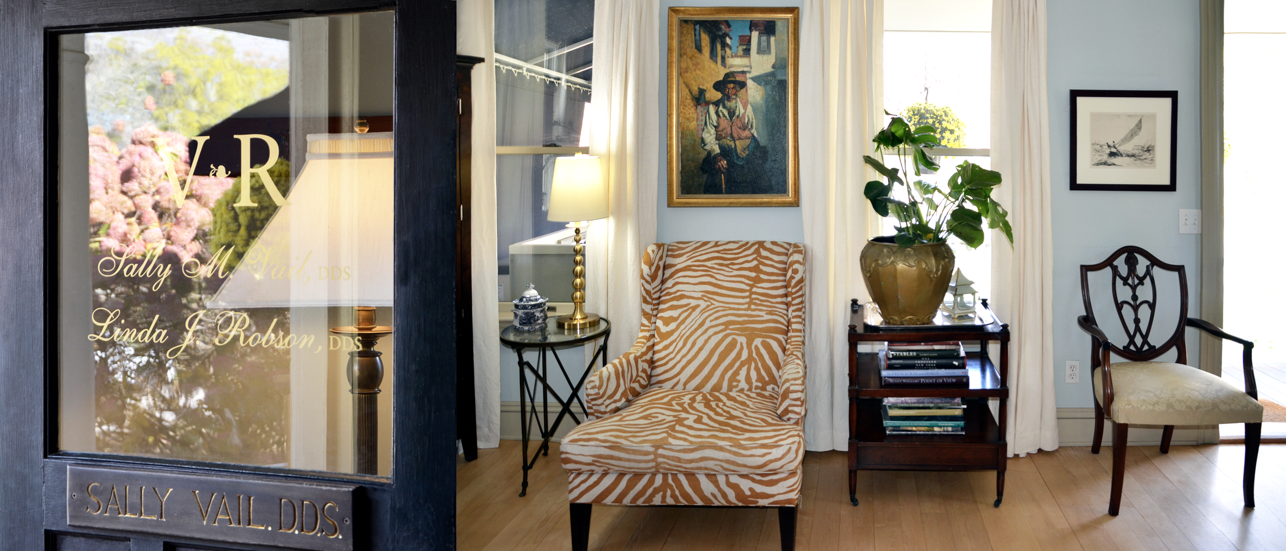 entrance door and waiting room at vail and robson dental practice. colors are light blue and gold wood floors plant in gold pot