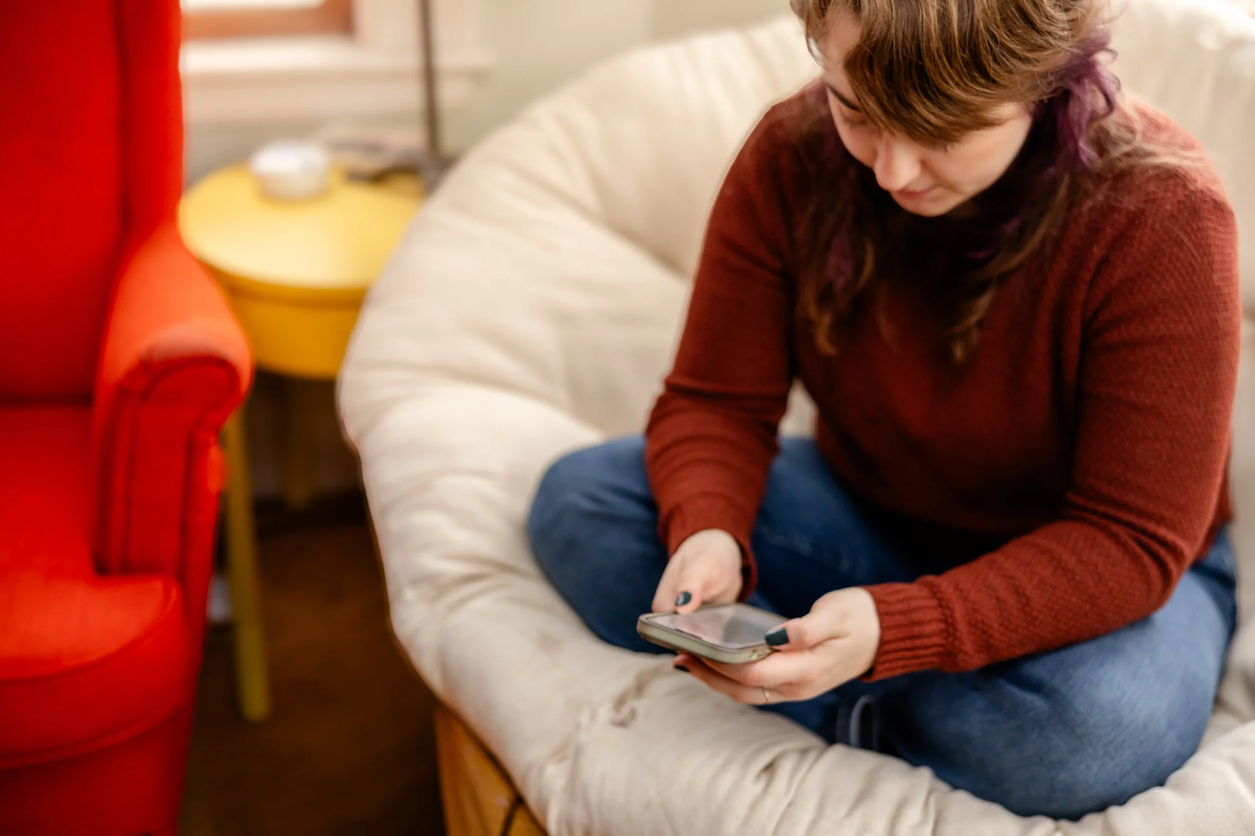 doula looking at phone texting