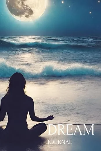 Silhouette of a person meditating on the beach at night with the moon and stars shining in the sky.