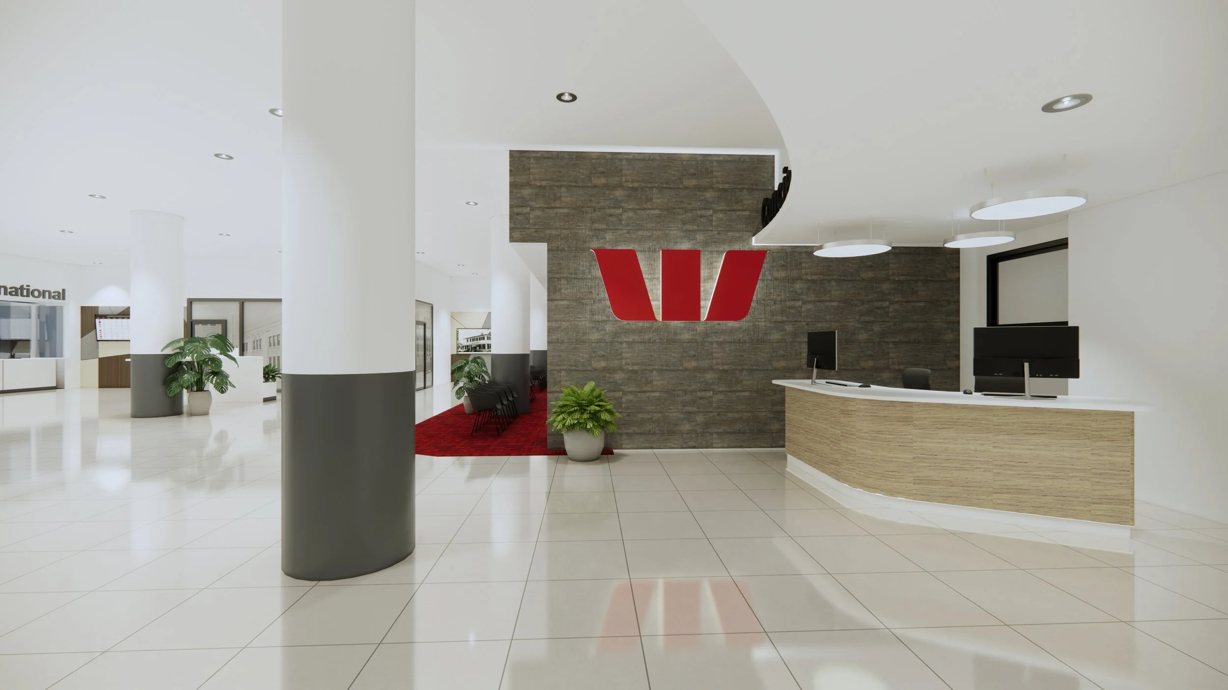 Modern hotel lobby with white walls, tiled floor, reception desk with two monitors, a red Westinghouse logo on a brick wall, seating area with chairs and plants, and a red carpet in the background.