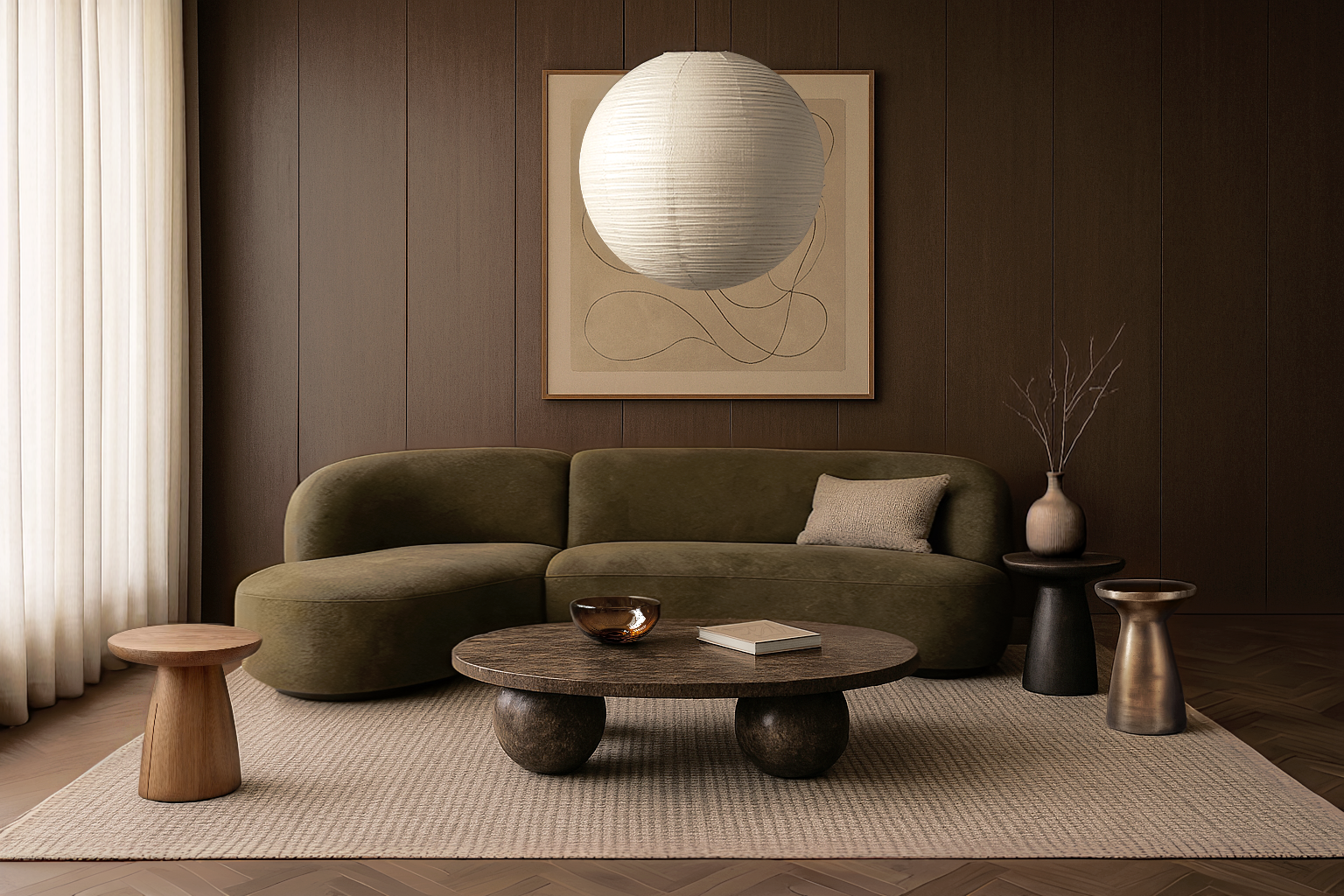 Living room with a green sofa, a round wooden coffee table, and two small side tables, one black and one metallic, with a beige vase holding branches on the black side table. A beige cushion rests on the sofa. There's a large framed abstract line art