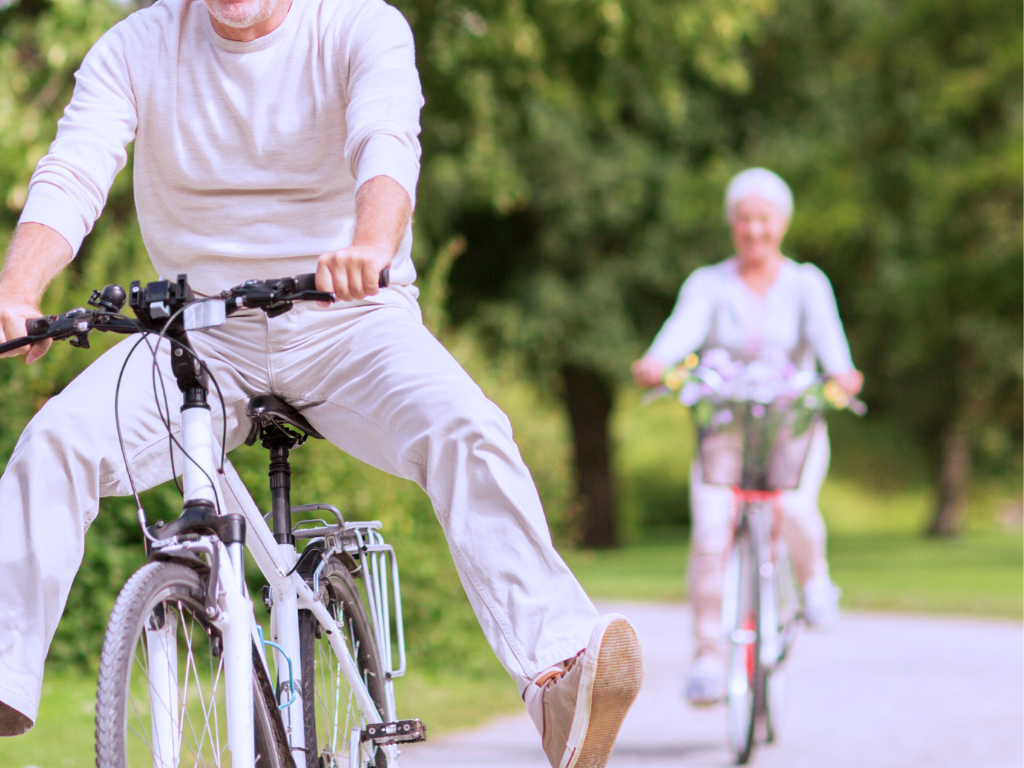 Happy older couple riding bicycles