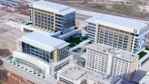 An aerial view of modern multi-story office buildings with glass facades and landscaped courtyards.