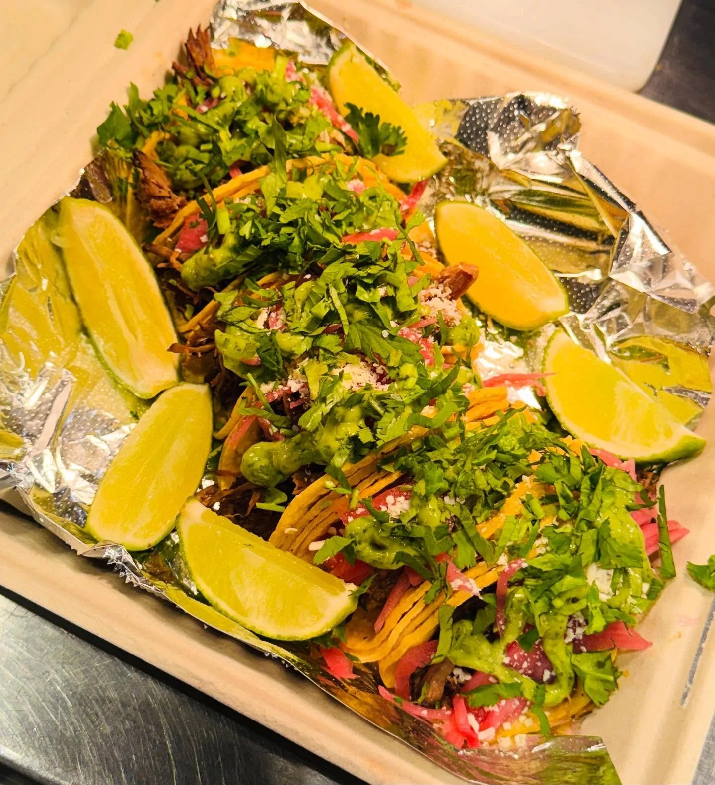 Smoked brisket (barbacoa) street tacos at Taco Pegaso, served with your choice of chips and dip on the side. A perfect balance of smoky, savory, melt-in-your-mouth deliciousness.