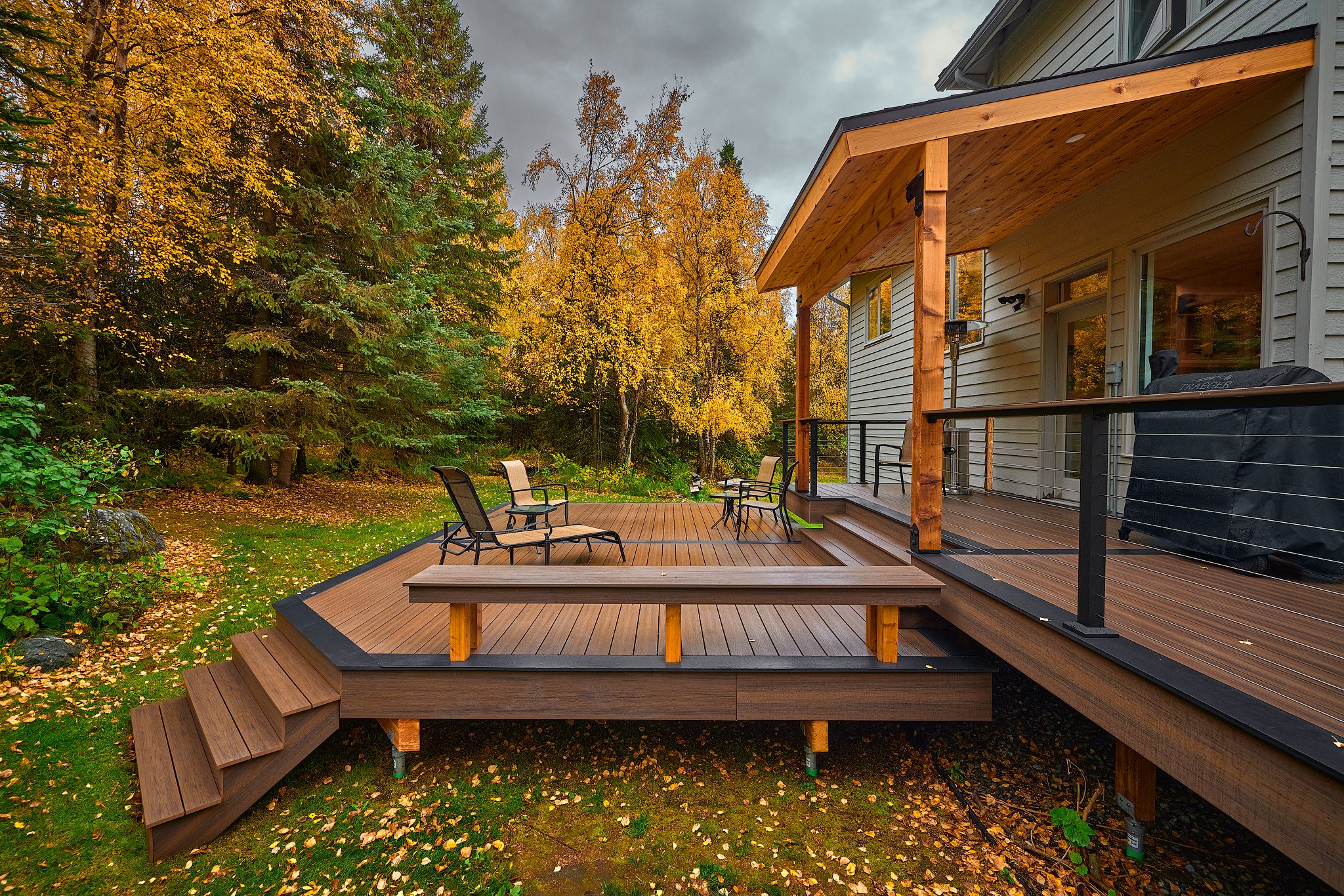 DECK DETAILS
·Deckorators Khaya deck surface
·Bordered in Dark Slate
·Deckorators ALX Contemporary cable railing with cocktail cap (khaya decking board)
·Cedar post bench with Khaya surface
·Custom cedar pergola with cedar soffit