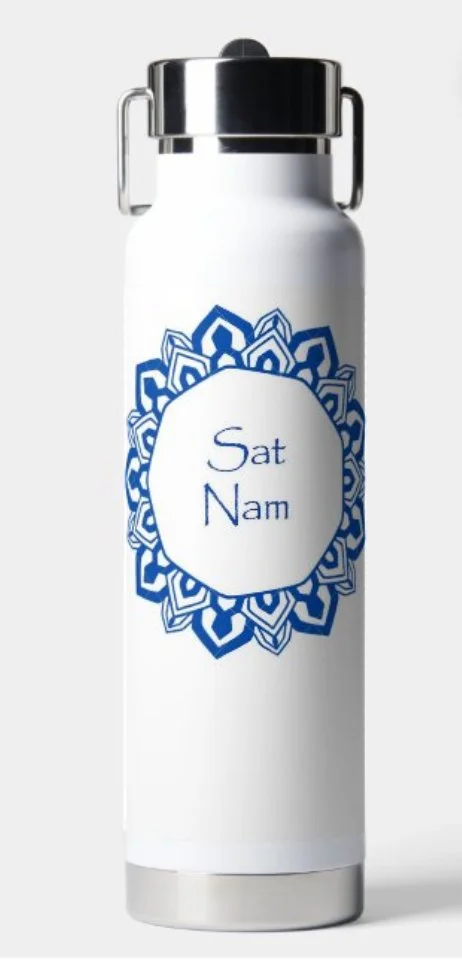 White water bottle with a silver cap featuring a blue mandala design and the words "Sat Nam" in blue text.