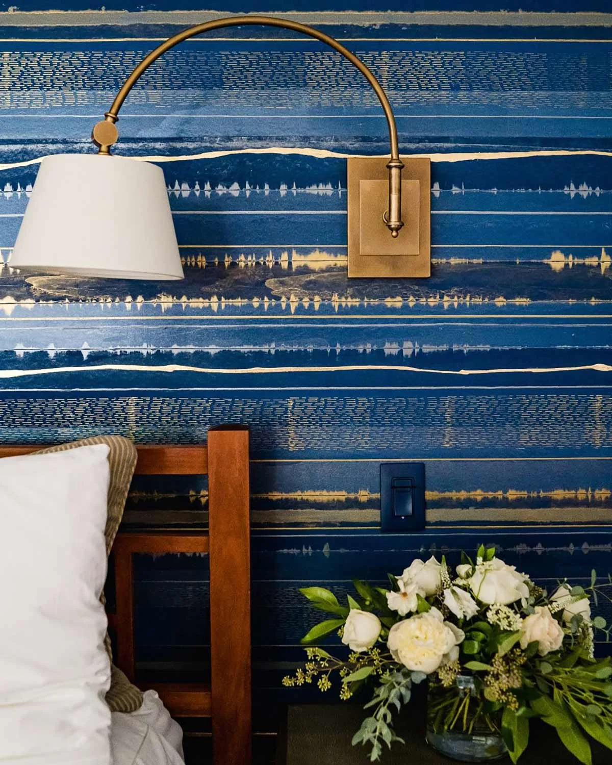  Lamina Indigo  • SKU 15-0209 • Layers upon layers of marble and mica plasters create this stratified continuous linear pattern. Finished with jewel-like lines this paper can create a horizontal pattern that wraps around the environment seamlessly or