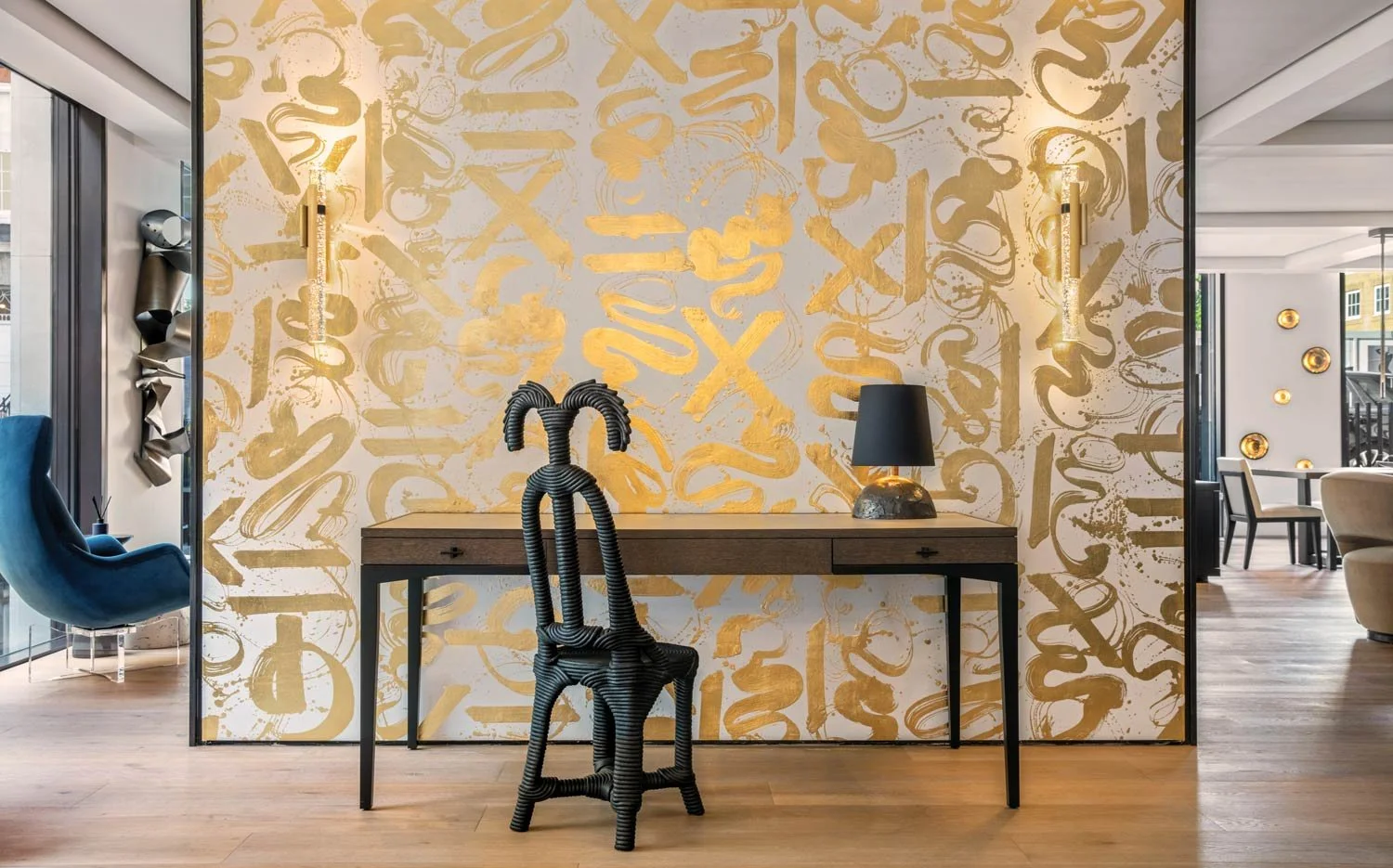  Basho Leaf Salt Gold  • SKU 17-0531 • Calligraphic strokes of hand-applied gold leaf on marble plaster create a space that is both precious and bold.