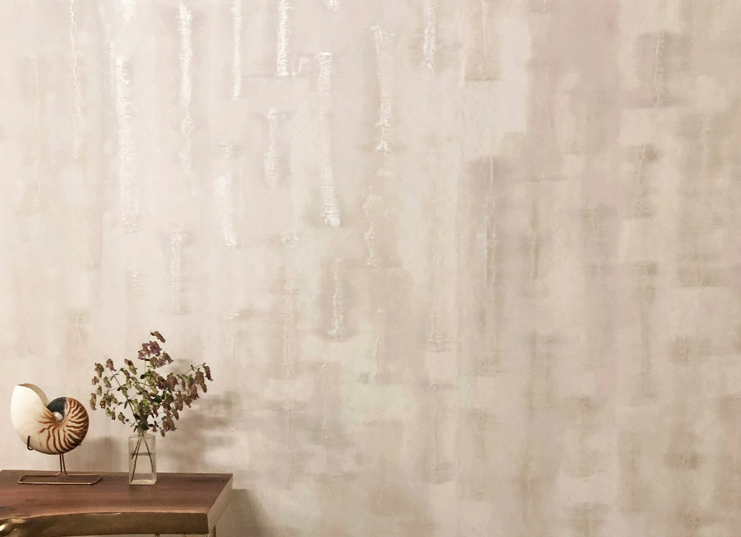  Abyss Pearl  • SKU 15-0195 • Layers of hand-applied plaster encapsulating micaceous and metallic resins. This lustrous paper is reminiscent of the glowing interior of an abalone shell.