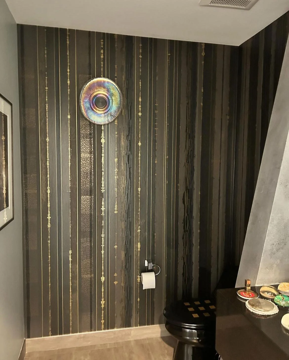  Lamina Chocolate  • SKU 11-0129 • Layers upon layers of marble and mica plasters create this stratified continuous linear pattern. Finished with jewel-like lines this paper can create a horizontal pattern that wraps around the environment seamlessly