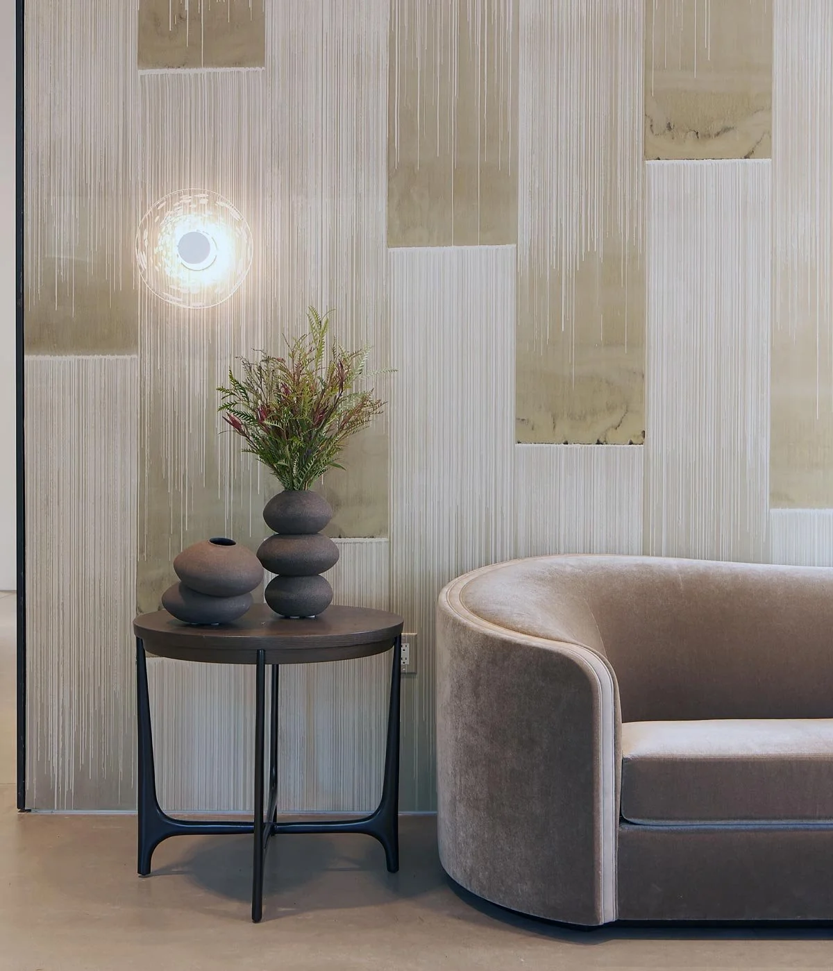  Decca Sand  • SKU 19-0753 • The alchemy of ink, mica and metal powders are revealed through bold shimmering, vertical brush strokes on a base of soft matte marble plaster.