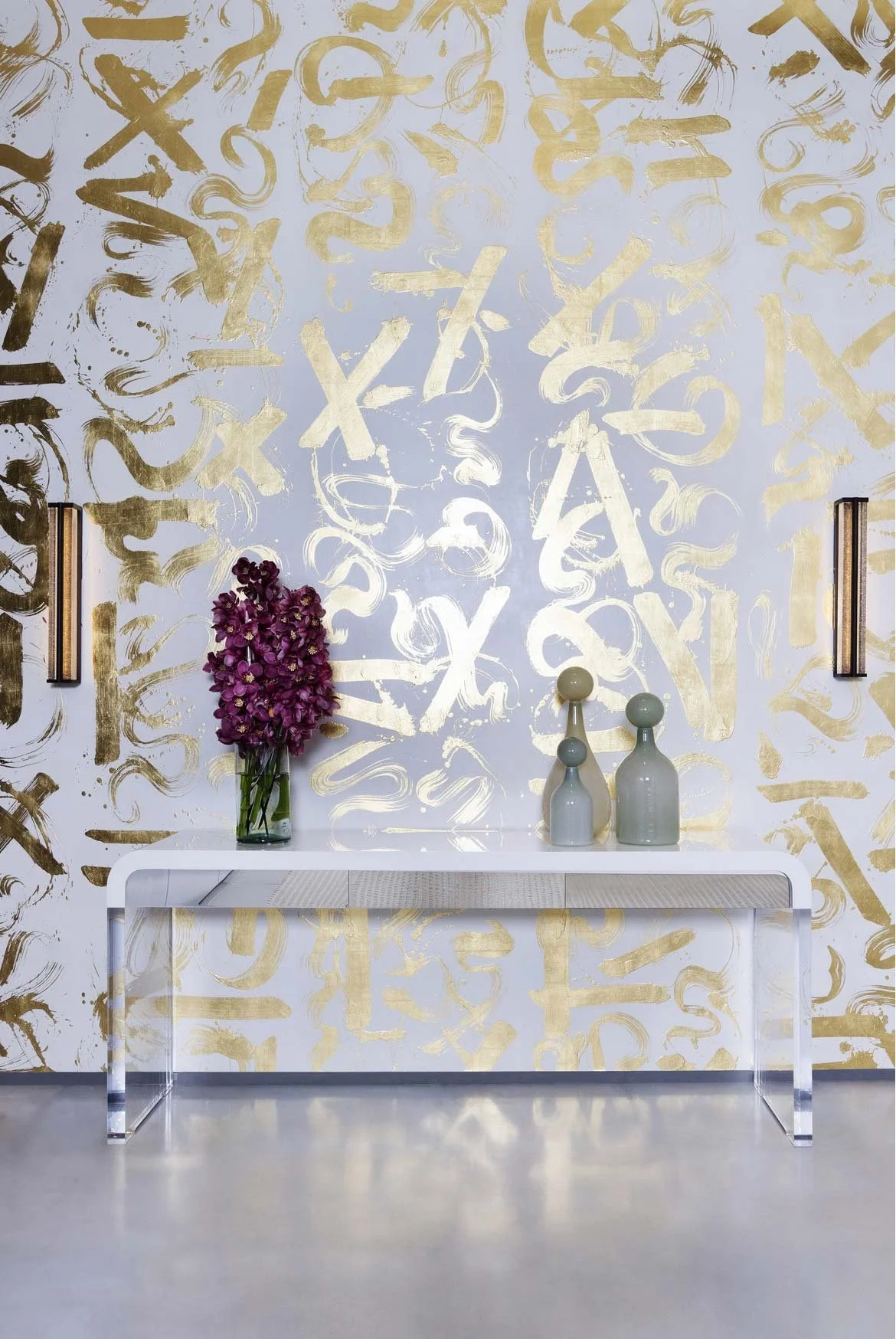  Basho Leaf Salt Gold  • SKU 17-0531 • Calligraphic strokes of hand-applied gold leaf on marble plaster create a space that is both precious and bold.