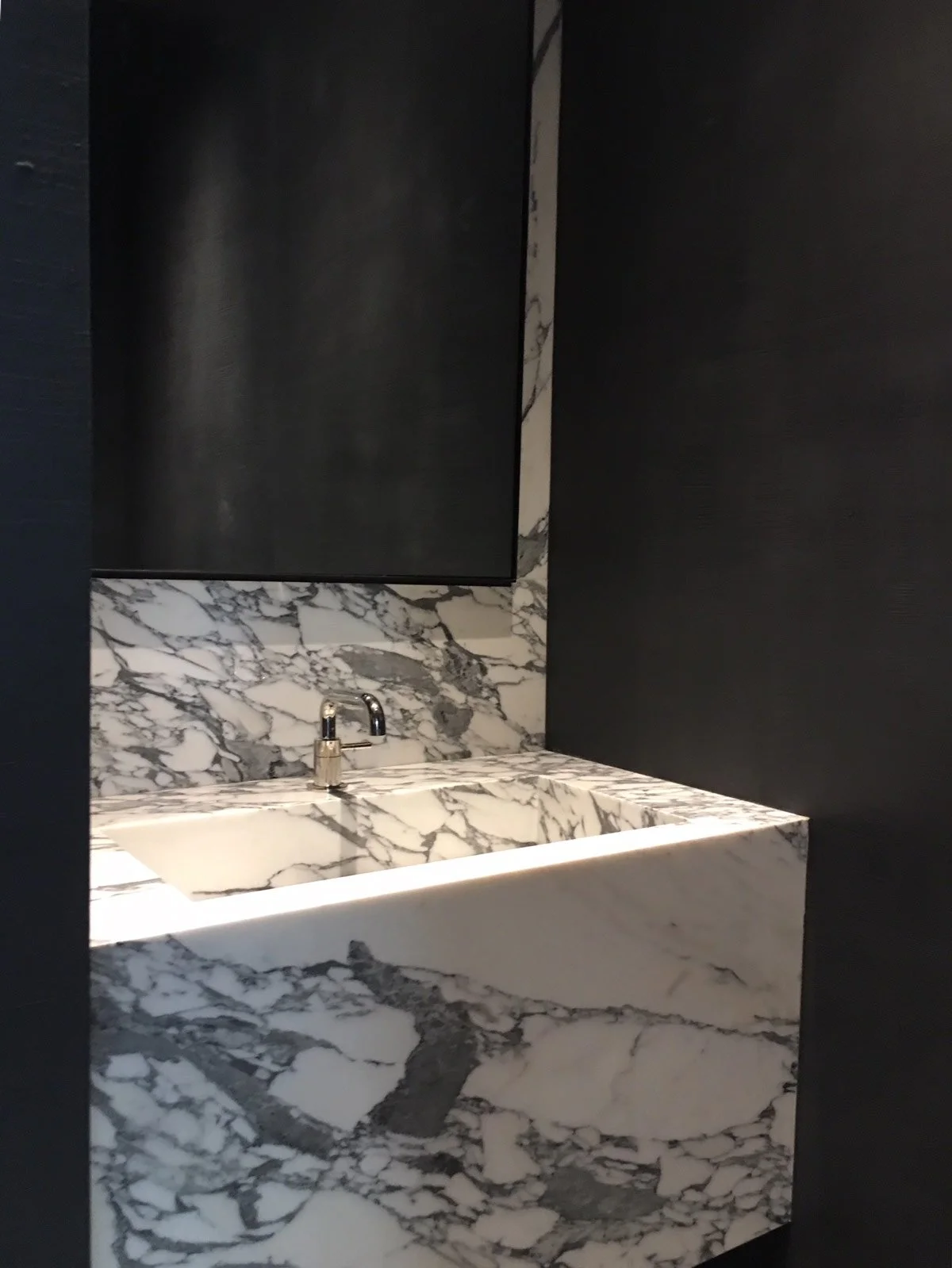  Honed Charcoal  • SKU 17-0521 • Like marble that has been ground smooth and rubbed to a soft sheen, this paper has the look and feel of gently polished stone.