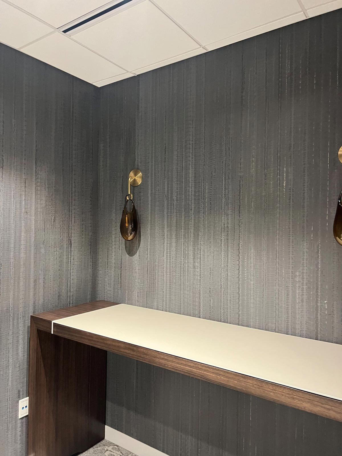  Arashi Charcoal Pewter  • SKU 15-0291 • Alternating passes of troweled and bladed marble plaster create this delicate and organic vertical stripe. The subtle variation in color and honed sheen reflect the beauty of the material.