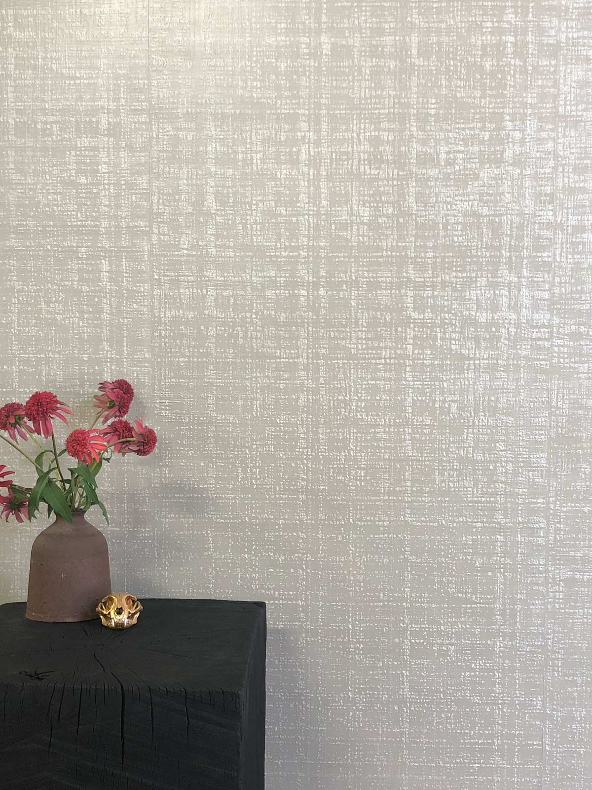  Bast Stone  • SKU 16-0341 • Inspired by Coco Chanel’s iconic bouclé, Bast is composed of six layers of burnished marble plaster sealed with beeswax. Although it is predominantly stone, this wallpaper has the warmth and elegance of luxurious textile.