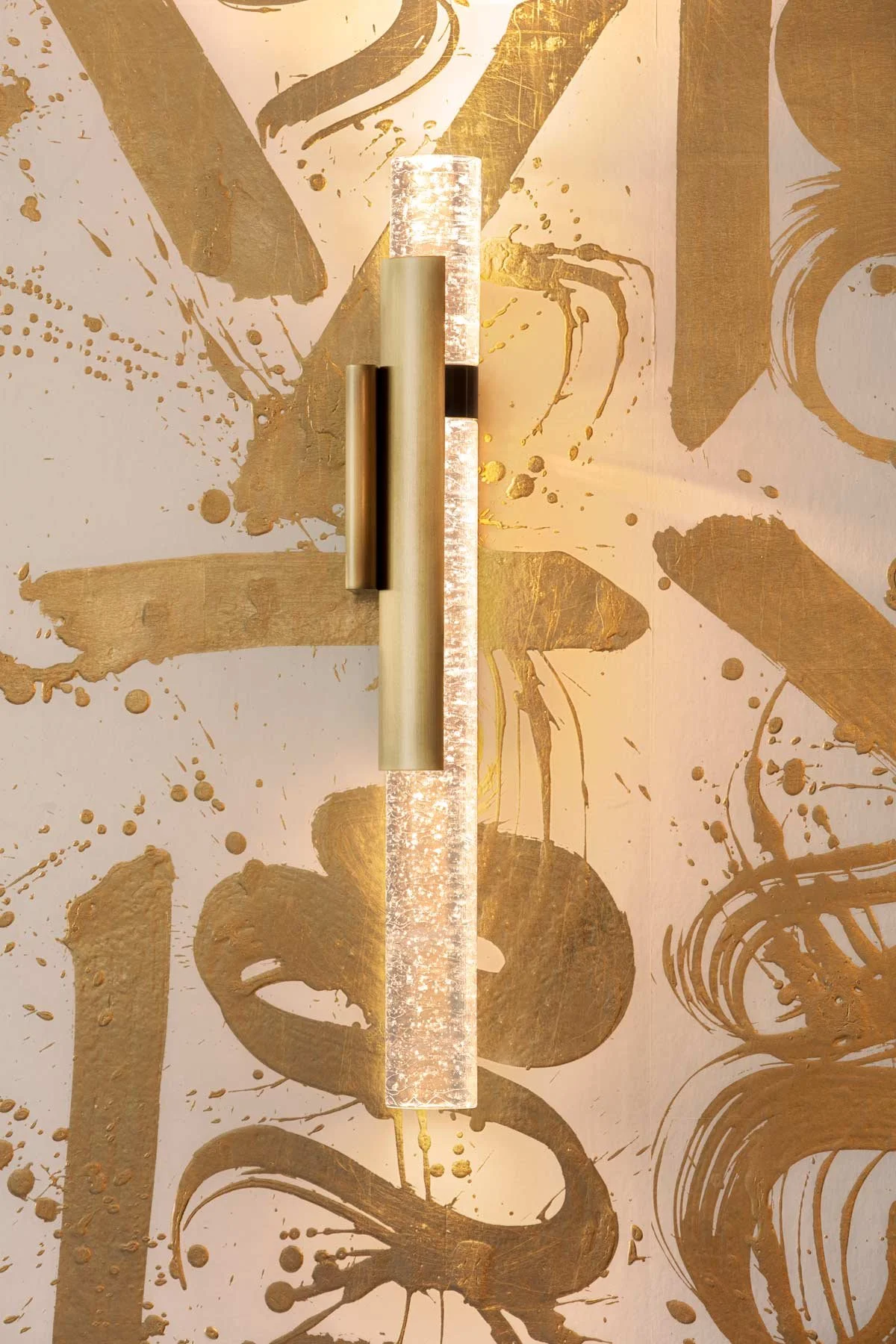 Basho Leaf Salt Gold  • SKU 17-0531 • Calligraphic strokes of hand-applied gold leaf on marble plaster create a space that is both precious and bold.