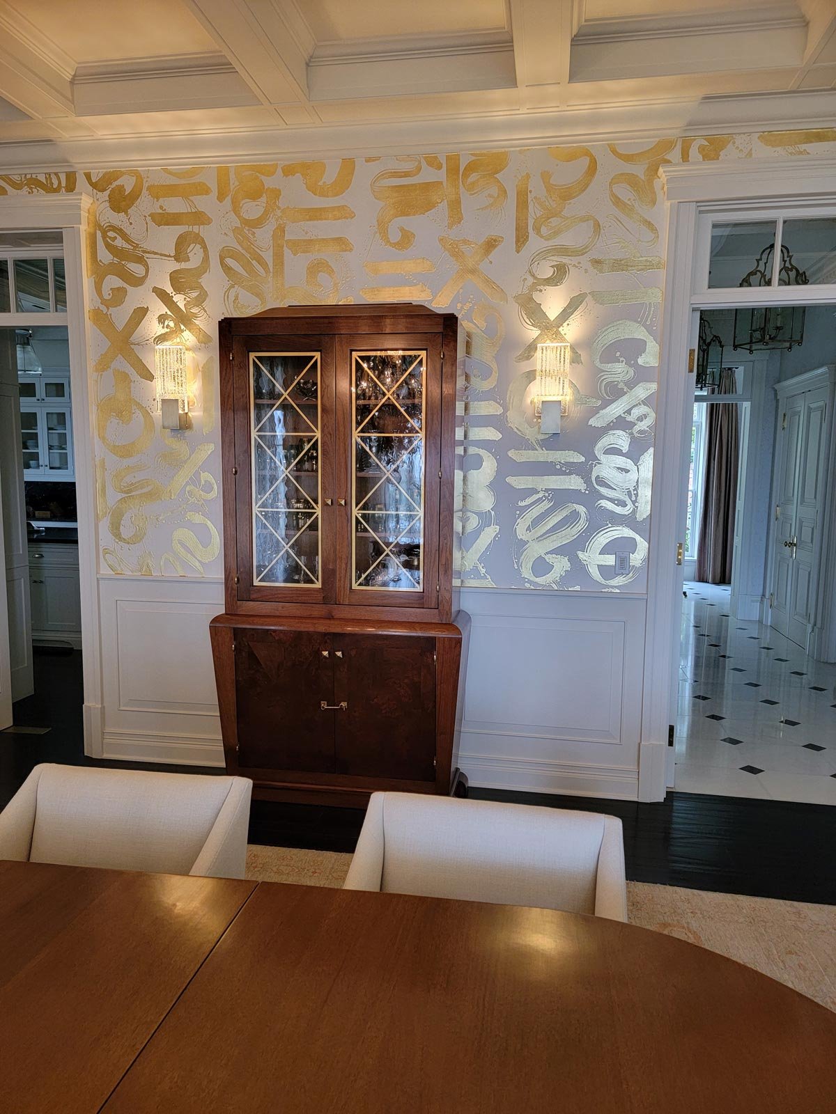  Basho Leaf Salt Gold  • SKU 17-0531 • Calligraphic strokes of hand-applied gold leaf on marble plaster create a space that is both precious and bold.