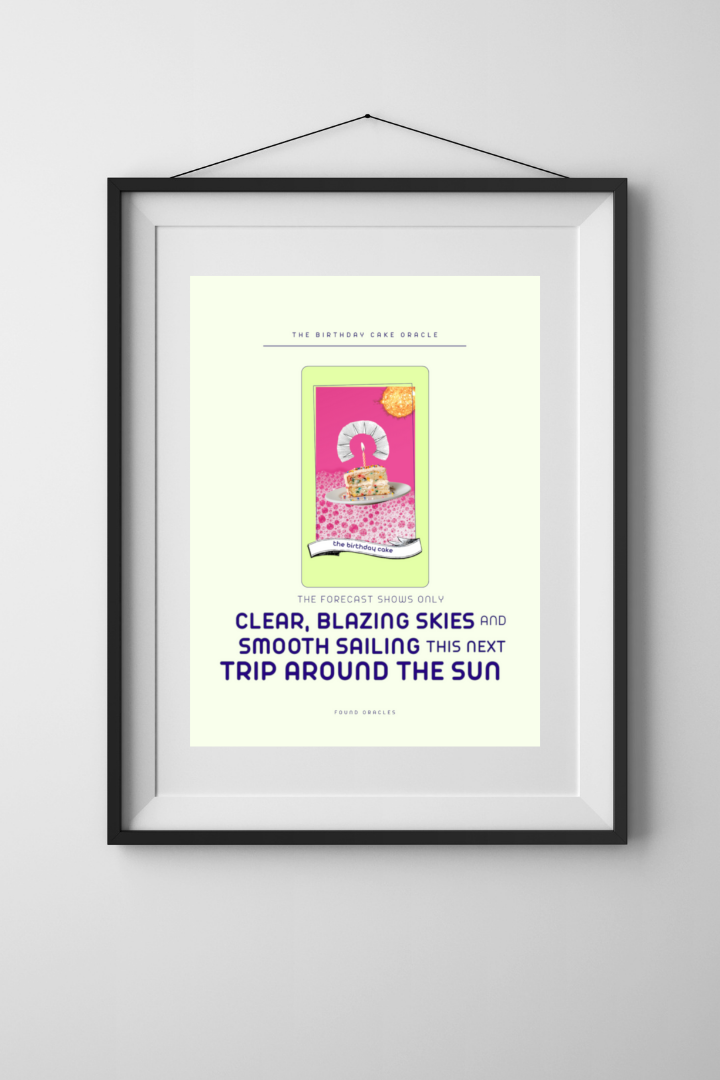 A collaged birthday cake oracle card in a hanging frame with text that says: The forecast shows only clear, blazing skies and smooth sailing this next trip around the sun. Found Oracles.