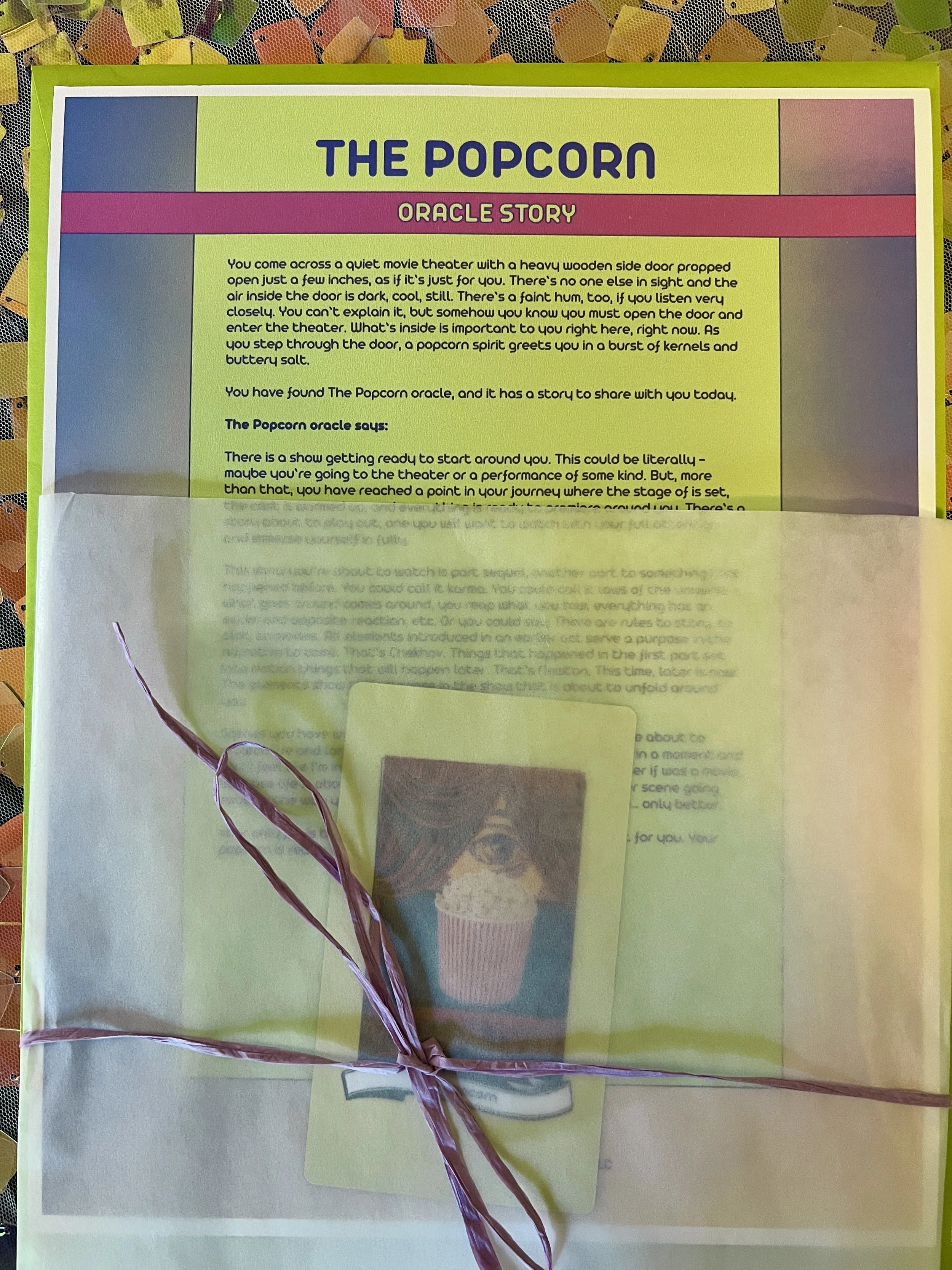 The Popcorn from Found Oracles printed story sheet peeking out of its glassine sleeve with story card visible inside.