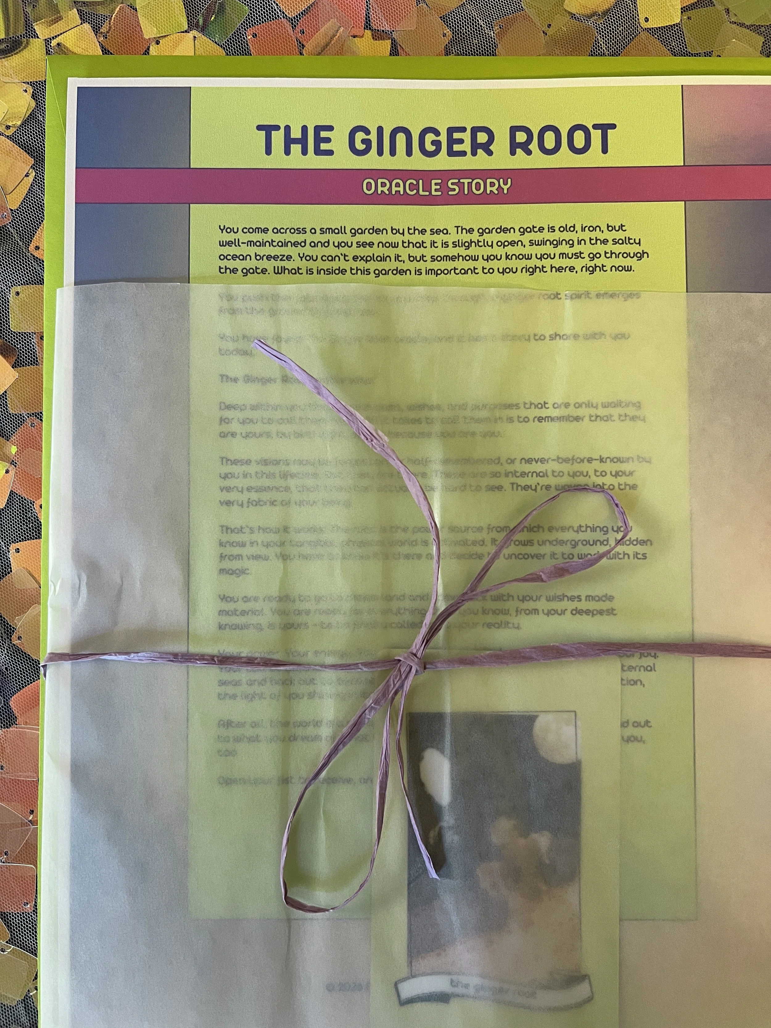 The Ginger Root from Found Oracles printed story sheet peeking out of its glassine sleeve with story card visible inside.