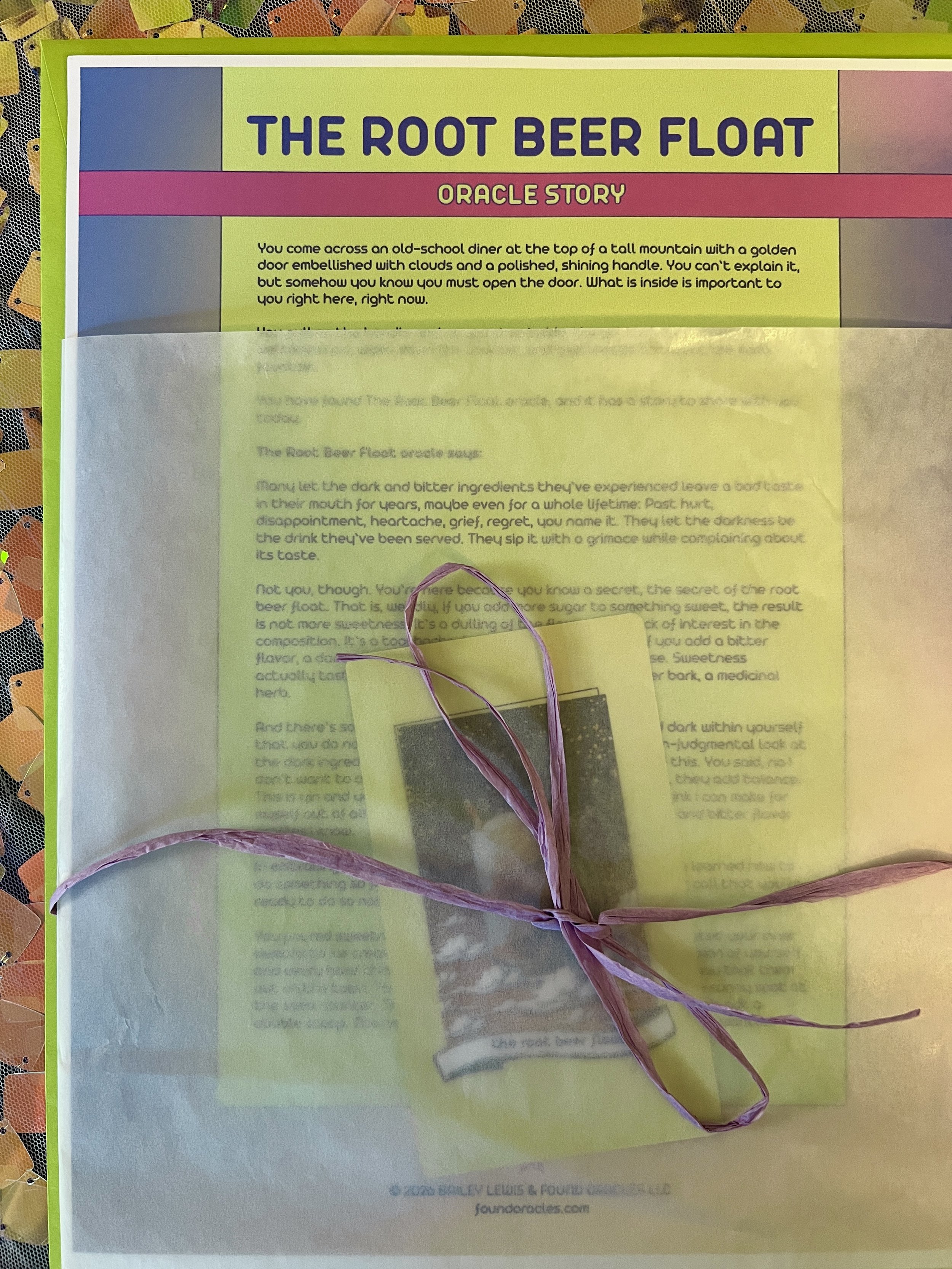 The Root Beer Float from Found Oracles printed story sheet peeking out of its glassine sleeve with story card visible inside.