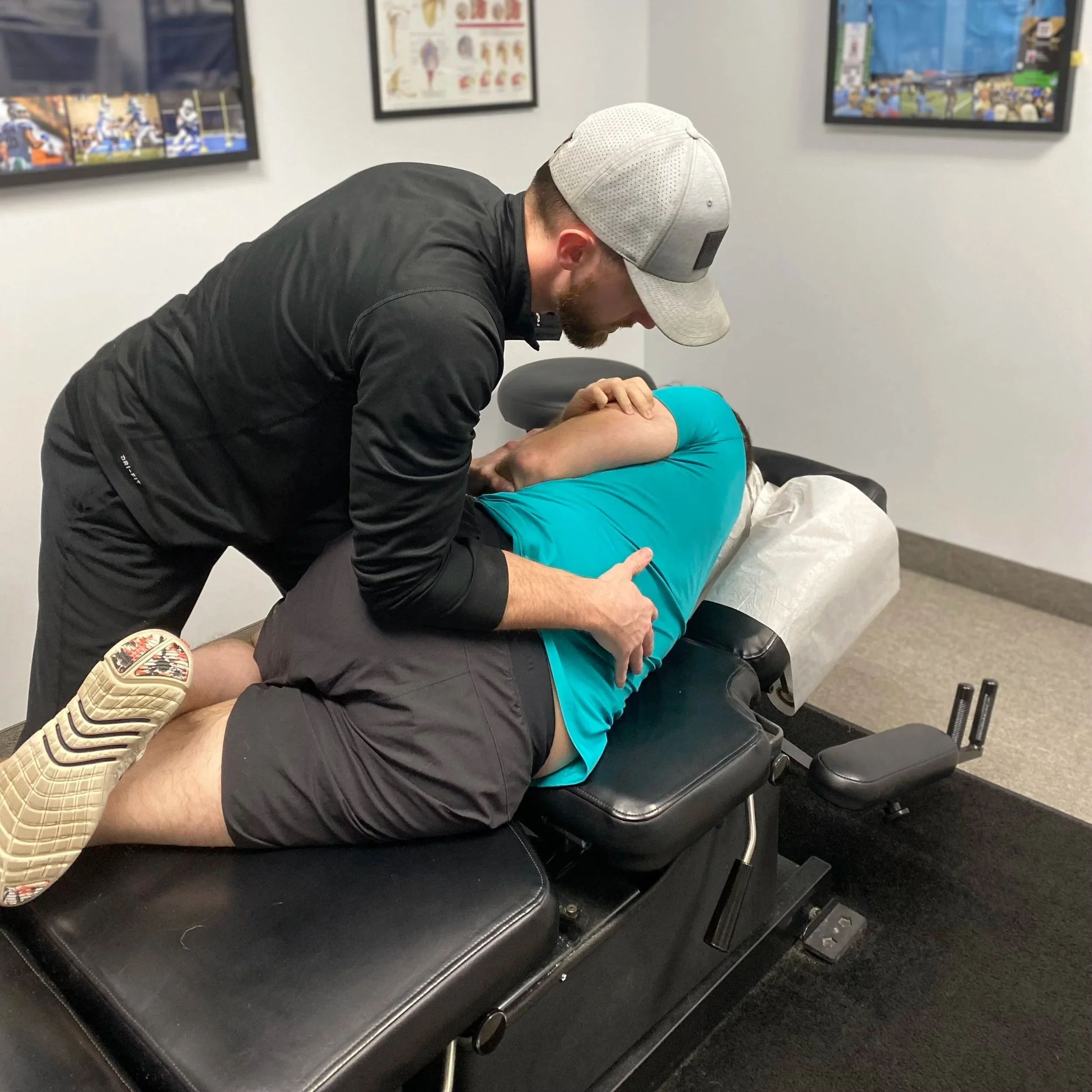 person receiving an adjustment at a chiropractic office