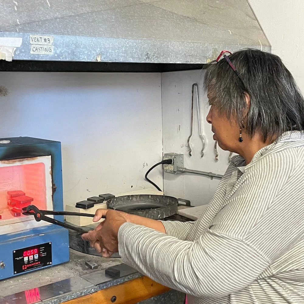 Cheryl calmly removing torque plates with billet in between for more 'hot squishing.' The bolts are gone now, so one needs a steady hand.