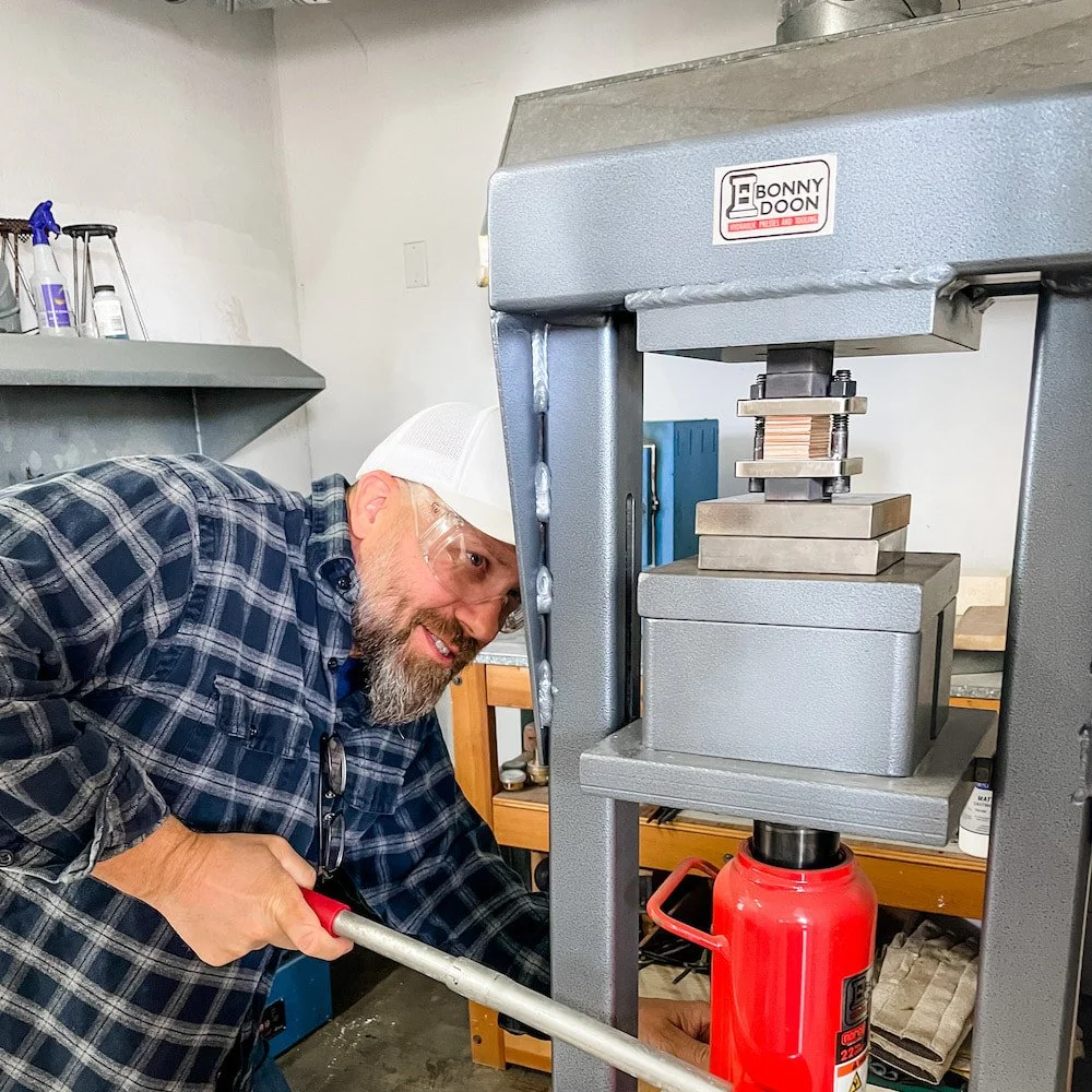 Metal has been scrubbed, and stacked, and put into torque plates. Here Sean is putting pressure on the assembly - bolts are tightened while the stack is under pressure. 