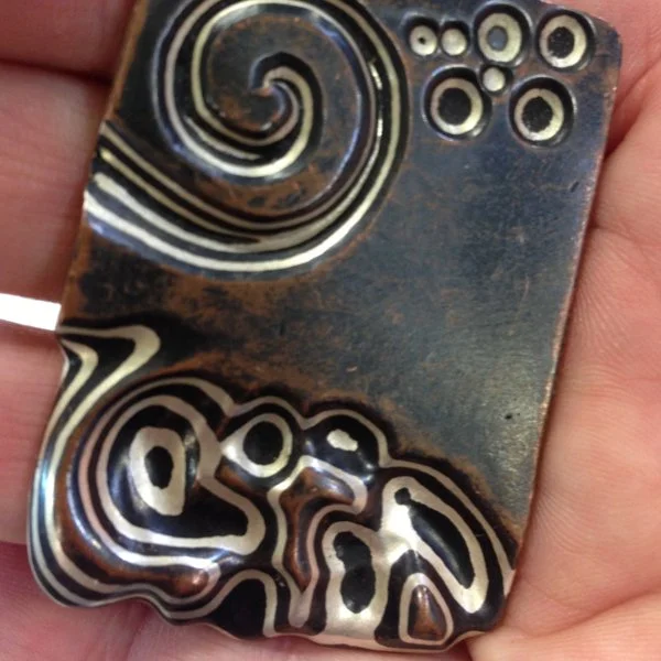 Mokume patterned by Jim Binnion in the guri bori style. Very nice. Want to try.