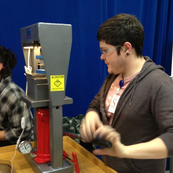 Spencer pressing his billet down and showing proper use of safety gear.