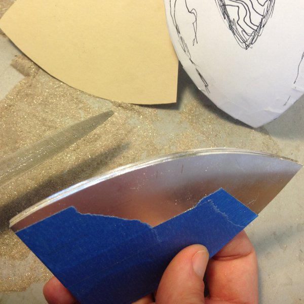 After sawing out the three sides, I have to file them so they are exactly the same shape and size.
