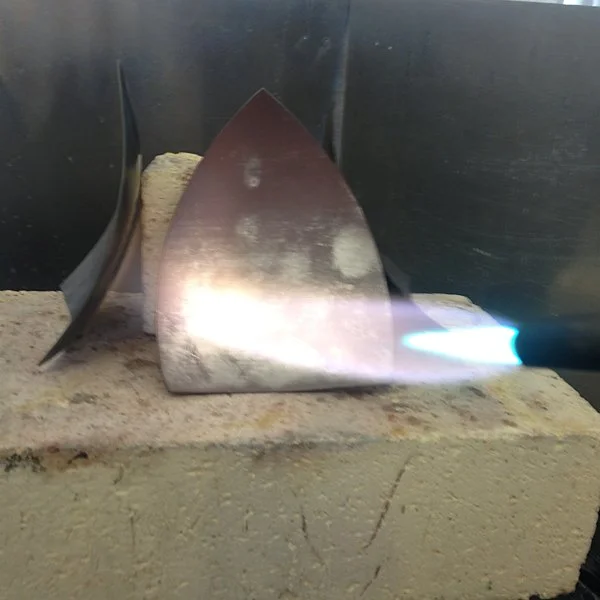 Annealing the sides to soften them for forming.