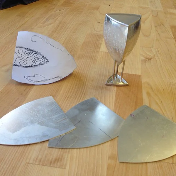 Three sides cut out - about $120 of silver. Shown with paper model and older vessel of the same basic shape.