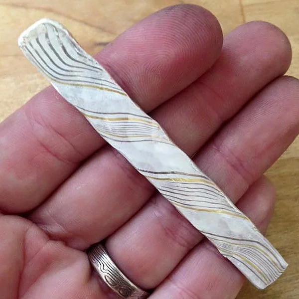 Forged flat after twisting. Already loving how the 22k gold pops.