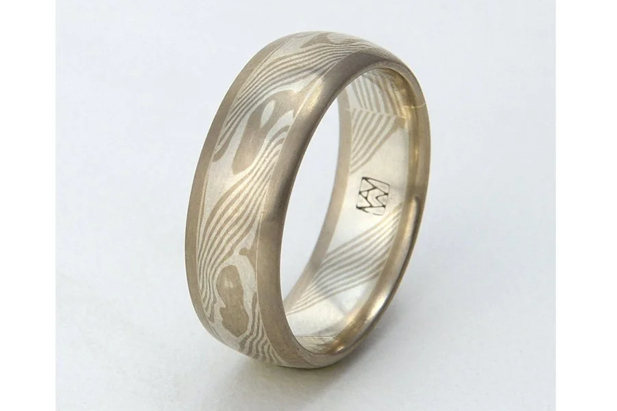 Tsuchi (Earth) ~ Central core of mokume, with patterning that mirrors the complex metamorphic and topological patterns of our planet. Visually grounded and framed with rose, yellow or white gold edging. Looks best from 6 to 8mm wide.