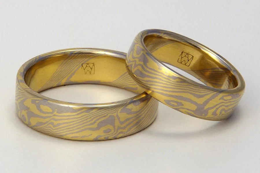 Custom color choice: 18k yellow gold with 950 palladium. Smooth (this material cannot be etched).