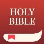 Cover of the Holy Bible with a red background and a white bookmark.