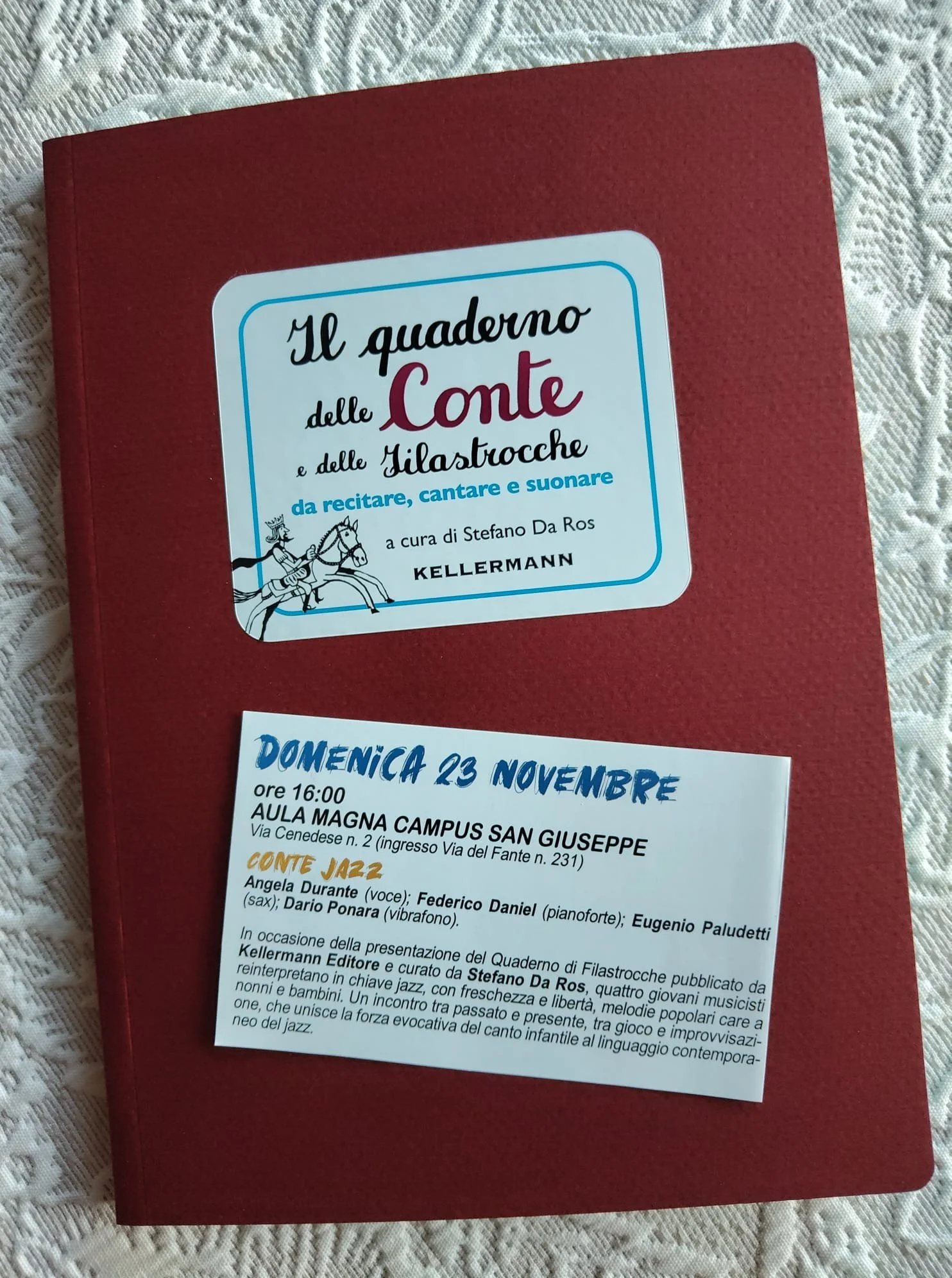 Red book cover with a white label featuring Italian text and a small illustration of two knights on horses.