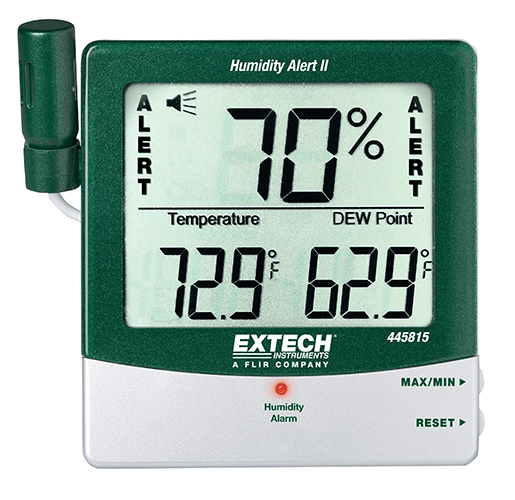 Green digital humidity and temperature monitor displaying 70% humidity, 72.9°F temperature, and 62.9°F dew point, with humidity alarm indicator and reset button.